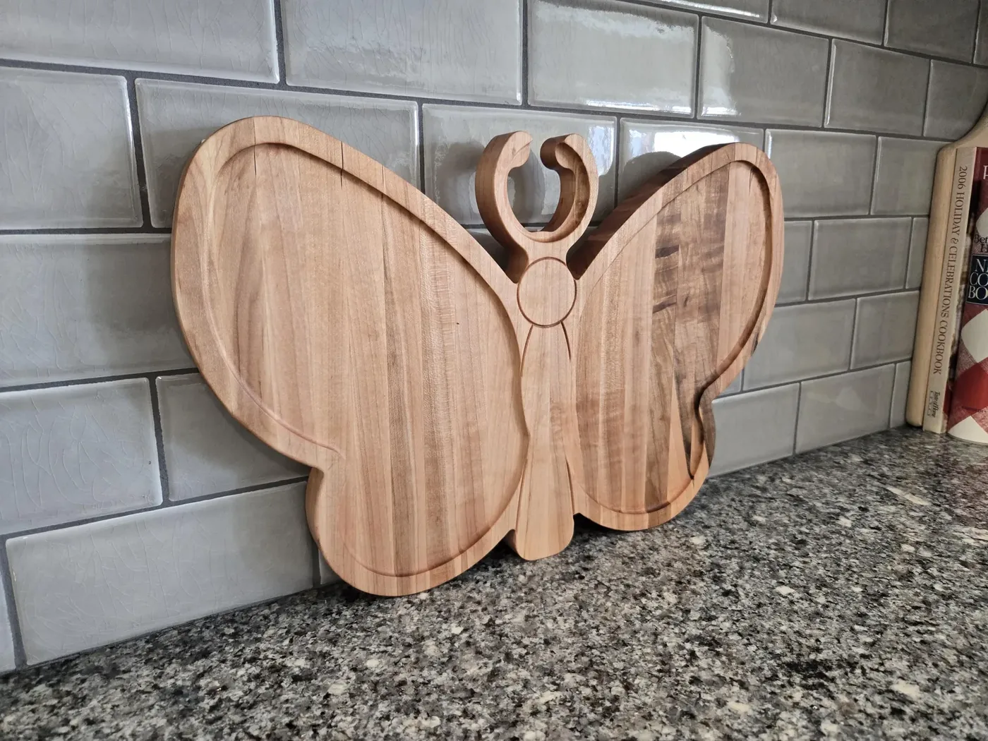 Butterfly-shaped wooden charcuterie board
